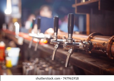 Many Beer Taps In The Beer Bar