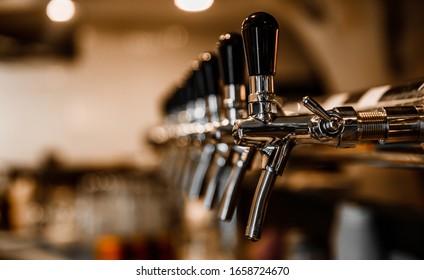 Many Beer Taps In Bar Or Pub