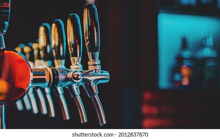 Many Beer Taps In Bar Or Pub