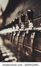 Many Beer Taps In Bar Or Pub. Tap Room