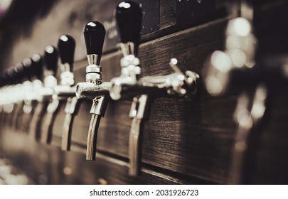 Many Beer Taps In Bar Or Pub. Tap Room