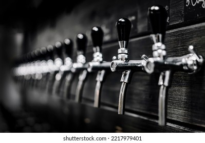 Many Beer Taps In Bar Or Pub. Tap Room