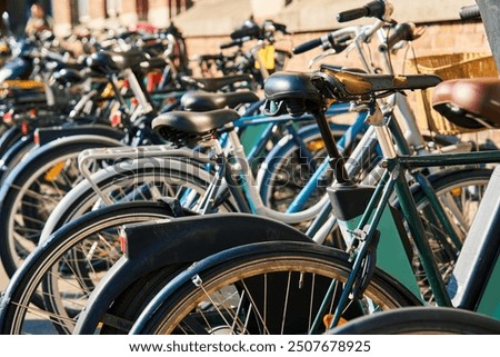 Similar – Image, Stock Photo Many bicycles parked at a public bike rack in Copenhagen