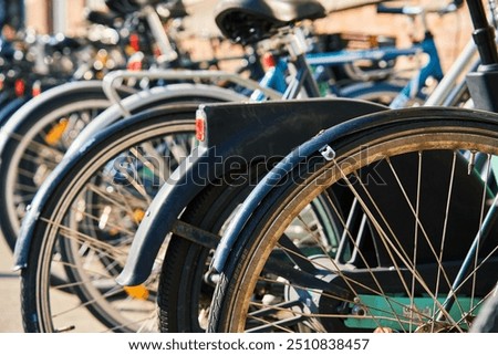 Similar – Image, Stock Photo Many bicycles parked at a public bike rack in Copenhagen