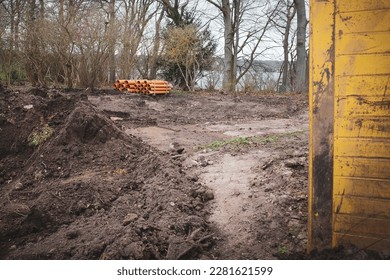 many big pipes lie on a construction site - Shutterstock ID 2281621599