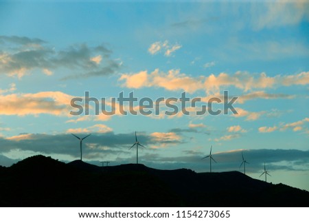 Many big windmills are on the mountains