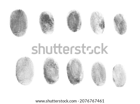 Many black fingerprints made with ink on white background, top view