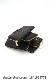 Many Black Snakeskin Wallets Purse In A Row Isolated On A White Background. Fashion Concept.