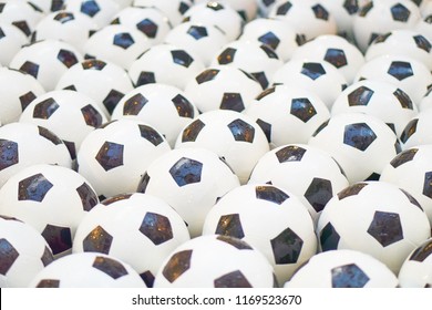 Many black and white soccer balls background. Football balls in a water - Powered by Shutterstock