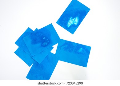 Many of blue Oil absorbing blotting sheets to remove excess oil on oily face, isolated on white background