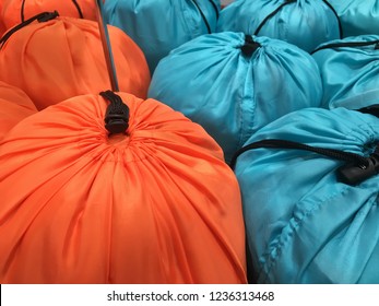 Many Of Blue And Orange Sleeping Bag Texture. Concept Of Hot And Warm Color 