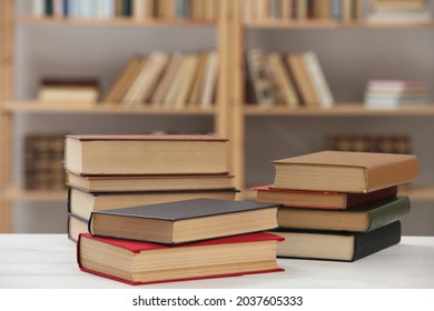 Many Books On White Table In Library