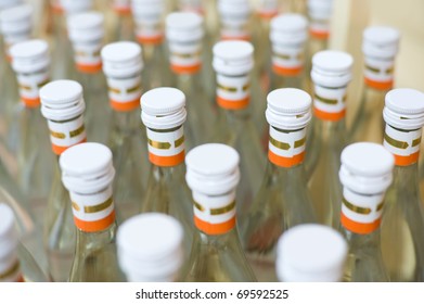 Many Bottles Of Vodka At Production Line Of Distillery