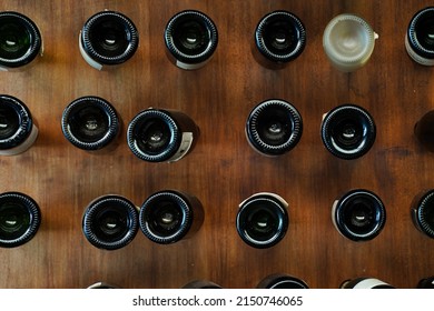 Many bottom of bottle wine stab on wooden wall for restaurant decoration interior design on wall backdrop.