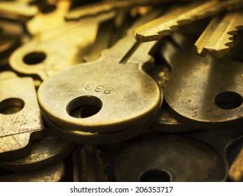 Many brass keys. Many brass keys extremely close up. Security and encryption, concept image. High magnification macro. 
