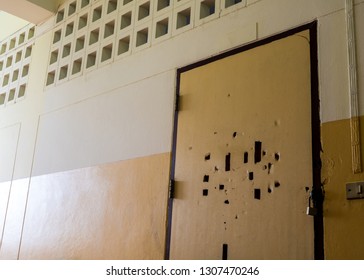 Many Broken Holes On The Old Classroom Door Are Locked