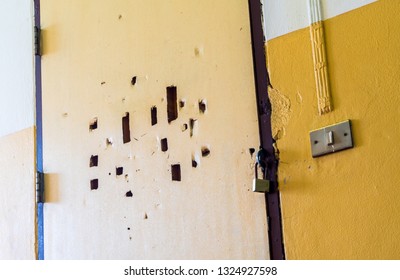 Many Broken Holes On The Old Classroom Door Are Locked