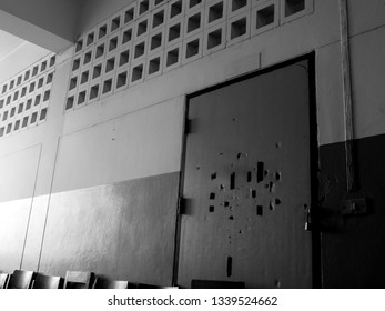 Many Broken Holes On The Old Classroom Door Are Locked