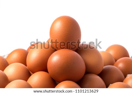 Many brown eggs in boxes.