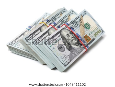 Many bundle of US 100 dollars bank notes isolated on white background 