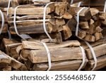 Many bundles of firewood piled up