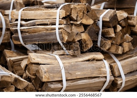 Many bundles of firewood piled up