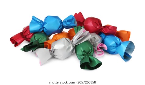 Many candies in colorful wrappers on white background