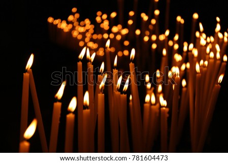 Similar – Many lighted candles in a church