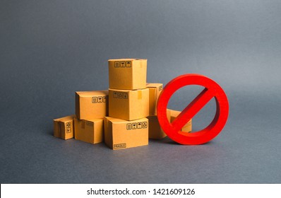 Many Cardboard Boxes And A Red Symbol NO. Embargo, Trade Wars. Restriction On The Importation Of Goods, Proprietary For Business. Inability To Sell Products, Ban On The Import. No Delivery.