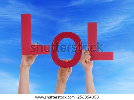 Many Caucasian People And Hands Holding Red Letters Or Characters Building The English Word Lol On Blue Sky