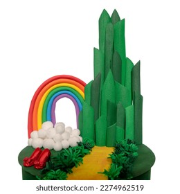 Many character in wizard of OZ. Magical fantasy team on cake made of craft paper. Emerald city gate and rainbow. Design cake of the theme is inspired by the movie wizard of OZ