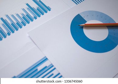 Many Charts And Glasses. Reviewing Data. Financial Reports And Glasses. Reflection Background.