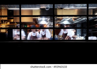 many chefs busy in kitchen - Powered by Shutterstock