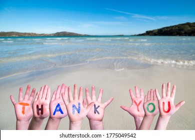 Many Children Hands Building Word Thank You, Ocean Background