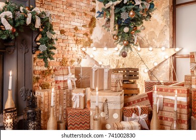 many Christmas gifts. Winter home decor. Christmas in loft interior against brick wall.