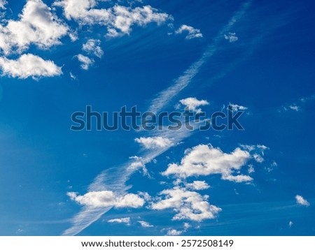Many clouds in the blue sky