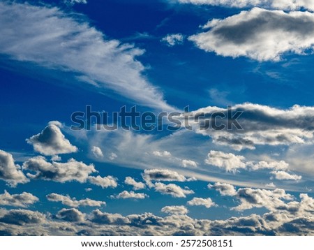 Many clouds in the blue sky
