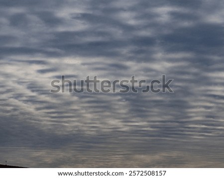 Many clouds in the blue sky