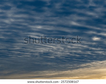 Many clouds in the blue sky