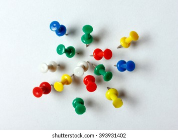 Many color thumbtacks (red, blue, green, yellow, white) - Shutterstock ID 393931402