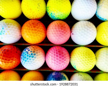 Many Colorful Golf Balls At The Practice Driving Range In Scratched Rack For Background Usage About Golf Or Recreational Sports Both Indoor And Outdoor Very Close Up Shot Horizontal Pic In Thailand  