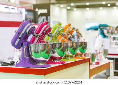 Many colorful and modern stand food mixer machine for industrial or home on table on blur background - Powered by Shutterstock