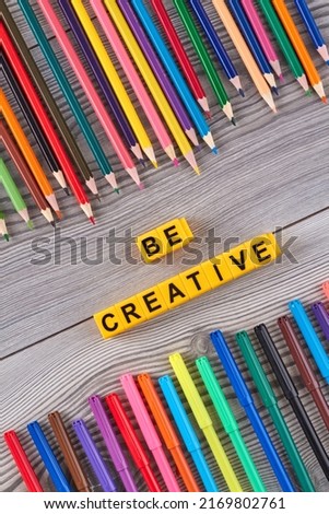 Many colorful pens and pencils on grey desk. Be creative concept.