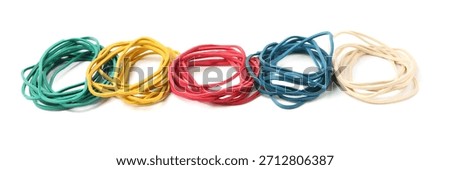 Many colorful rubber bands isolated on white