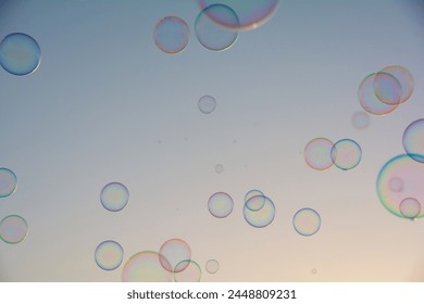 Many colorful soap bubbles float in the sky - Powered by Shutterstock