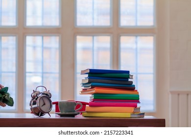 Many Colorful Textbooks Are Placed On  Desk In Study Room As They Are Prepared For Students To Review Learn And Understand Lesson Before Taking The Final Exam. Concept Of Learning And Understanding