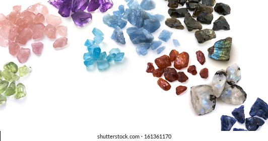 Many Colorful Uncut Gems On The White. Beautiful Gemstones Background Image.