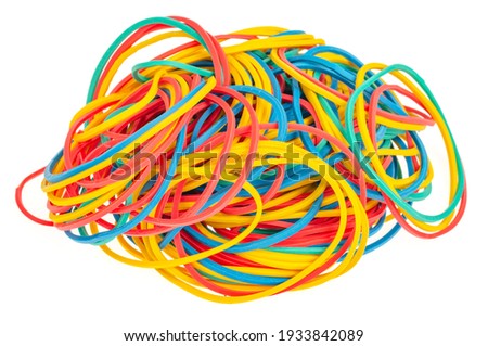 Many colourful multi coloured elastic rubber bands on white background. Studio Photo