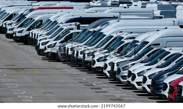 Many\
commercial vehicles parked next to each\
other