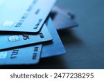 Many credit cards on dark background, closeup